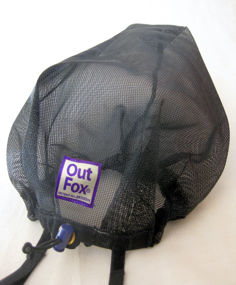 A black mesh protective cover with a purple label that reads 'Out Fox' and a patent number 8833311